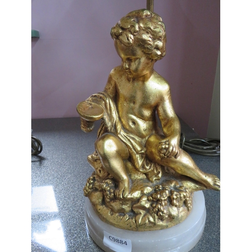 782 - Pair of Gold Painted Spelter Lamp bases featuring Cherub bodies,  Brass light column.  Each raised o... 