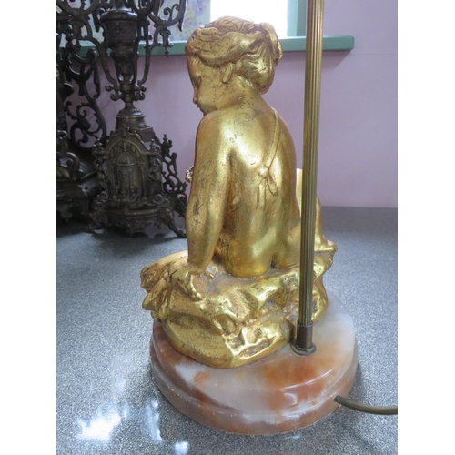 782 - Pair of Gold Painted Spelter Lamp bases featuring Cherub bodies,  Brass light column.  Each raised o... 