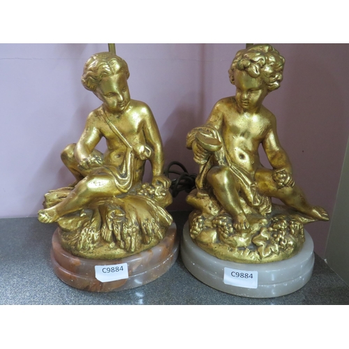 782 - Pair of Gold Painted Spelter Lamp bases featuring Cherub bodies,  Brass light column.  Each raised o... 