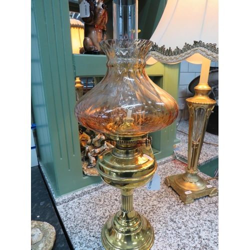 785 - Lovely Brass and Glass Oil lamp with short corinthian column base with brass reservoir. Lovely Amber... 