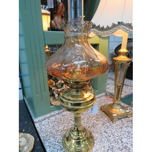 785 - Lovely Brass and Glass Oil lamp with short corinthian column base with brass reservoir. Lovely Amber... 