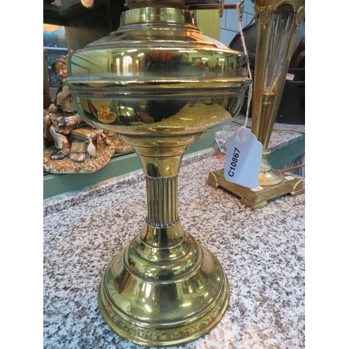 785 - Lovely Brass and Glass Oil lamp with short corinthian column base with brass reservoir. Lovely Amber... 