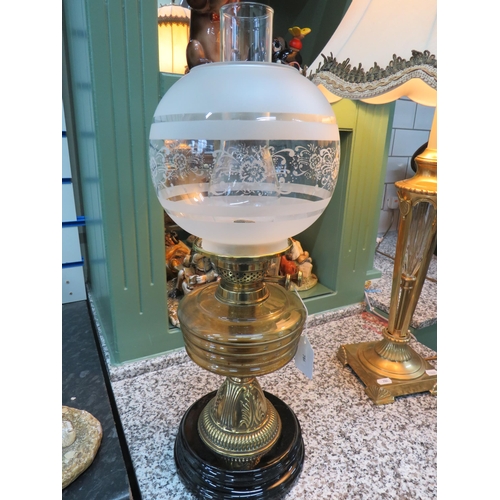 786 - Lovely Brass and Glass Oil Lamp raised on a Brass plinth with Amber glass reservoir with etched milk... 