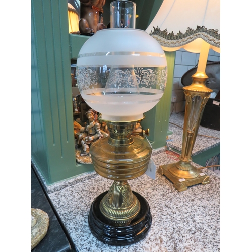 786 - Lovely Brass and Glass Oil Lamp raised on a Brass plinth with Amber glass reservoir with etched milk... 