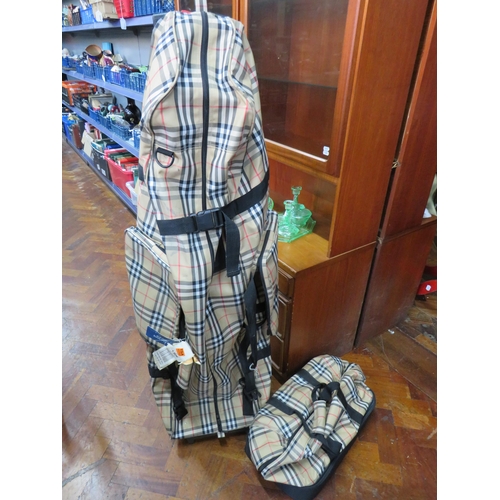 790 - Burberry Golf Bag with trolley (53 inches tall) along with a matching holdall .   All in good condit... 