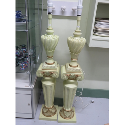 792 - Matched pair of electric lamps stood on a Greco/Romano style plinth.  Each in working order and tota... 