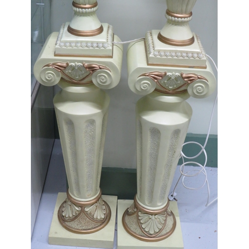 792 - Matched pair of electric lamps stood on a Greco/Romano style plinth.  Each in working order and tota... 