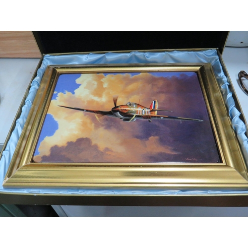 797 - Lovely framed ceramic picture of a WW2 Hurricane by Adrian Rigby.  Comes with silk and foam lined bo... 