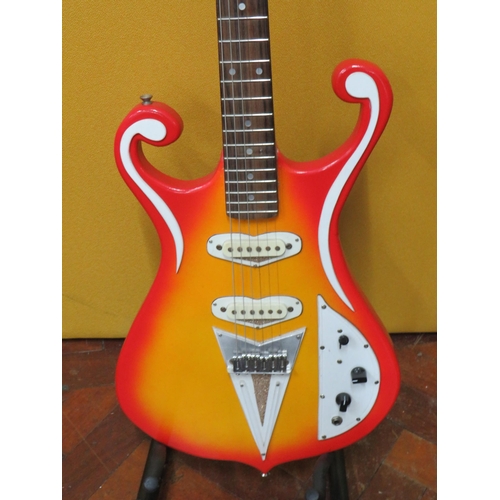 853 - Solid Bodied Six String Electric Guitar  in fair condition with light wear.  41 inches long. 3.2g. A... 