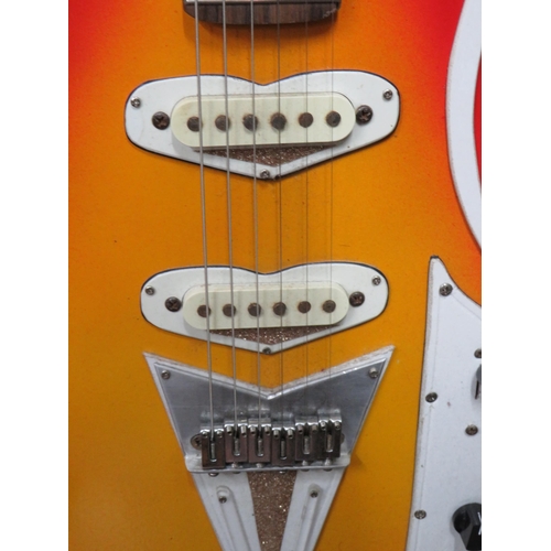 853 - Solid Bodied Six String Electric Guitar  in fair condition with light wear.  41 inches long. 3.2g. A... 