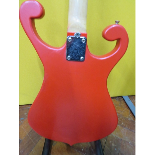 853 - Solid Bodied Six String Electric Guitar  in fair condition with light wear.  41 inches long. 3.2g. A... 