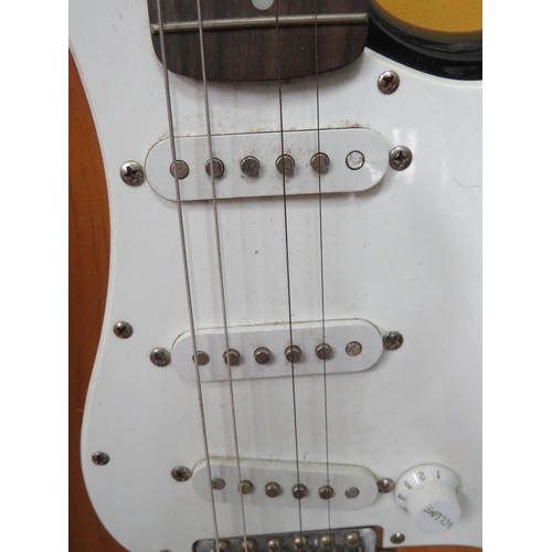 857 - Squire Stratocaster in fair condition with light superficial wear. Neck/Headstock is straight in goo... 