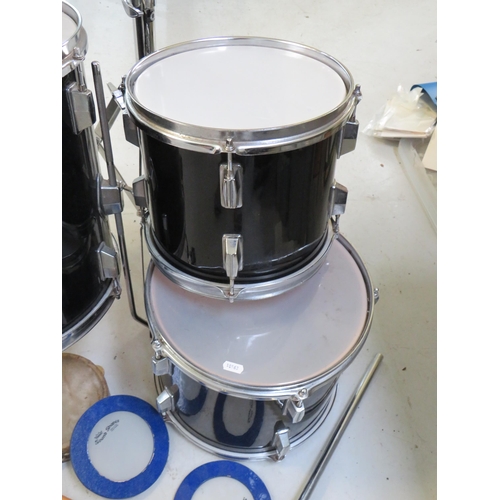 863 - Graduated set of three drums with chrome plated stand plus tamborine, cow bell , drumsticks etc. see... 