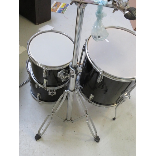 863 - Graduated set of three drums with chrome plated stand plus tamborine, cow bell , drumsticks etc. see... 