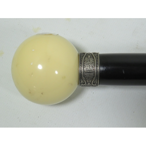 877 - Ebonised walking stick with Ivory coloured ball handle. 36 inches long. See photos.