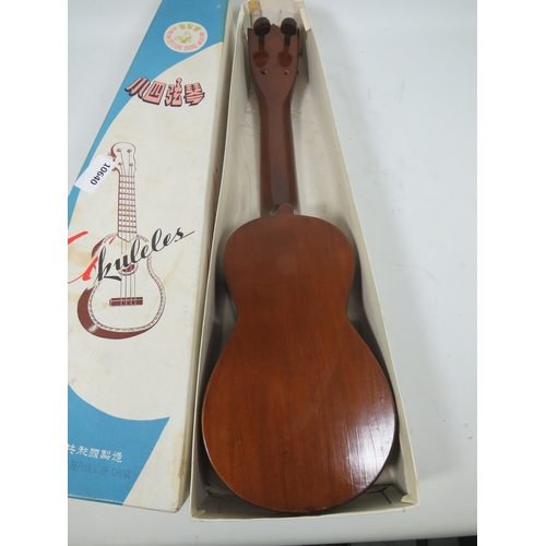 878 - Chinese ukelele with original box, no strings. See photos