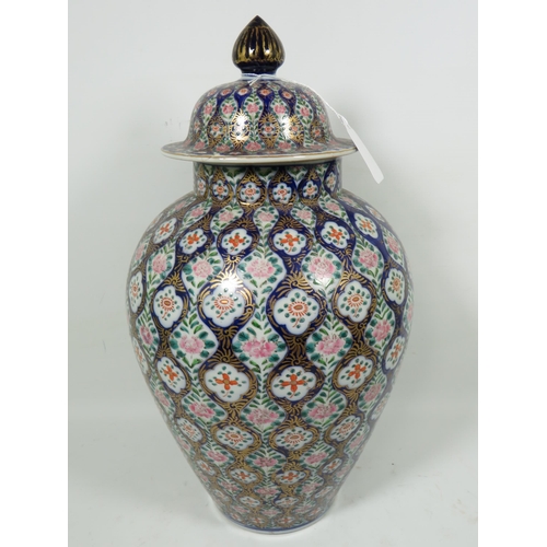 893 - Large Oriental style Ginger jar with lid. Slight nibble to underside of rim,  Measures approx 16 inc... 