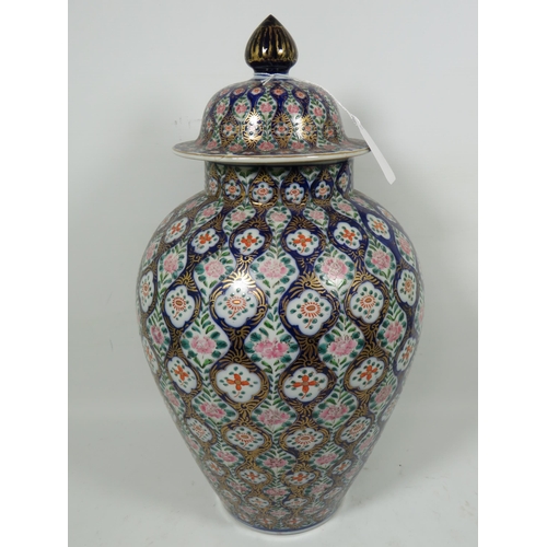 893 - Large Oriental style Ginger jar with lid. Slight nibble to underside of rim,  Measures approx 16 inc... 