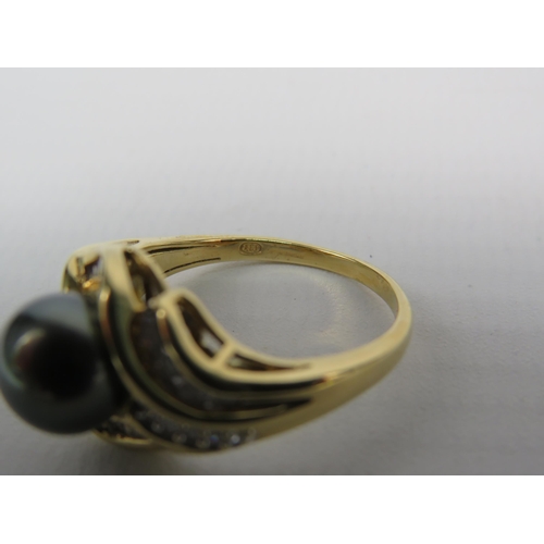 171a - 18ct yellow Gold Diamond and freshwater black pearl, finger size P. 7.1 Grams.