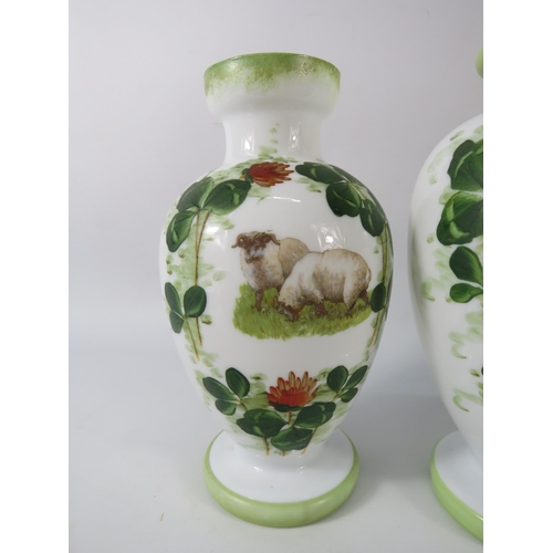 10 - Antique opaline milk glass transfer and handpainted vases and lidded jar, the tallest measures 13.5