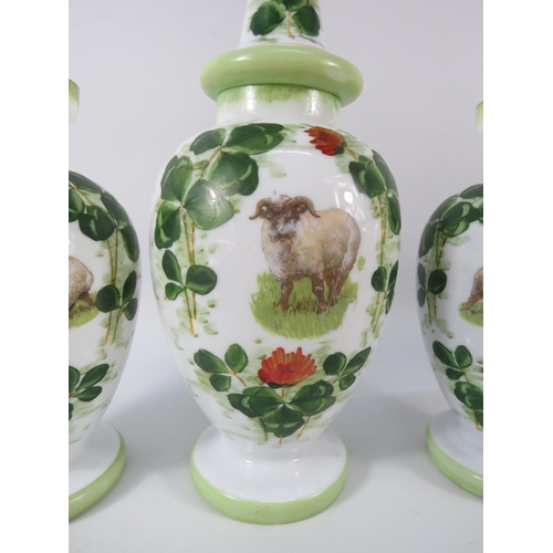 10 - Antique opaline milk glass transfer and handpainted vases and lidded jar, the tallest measures 13.5