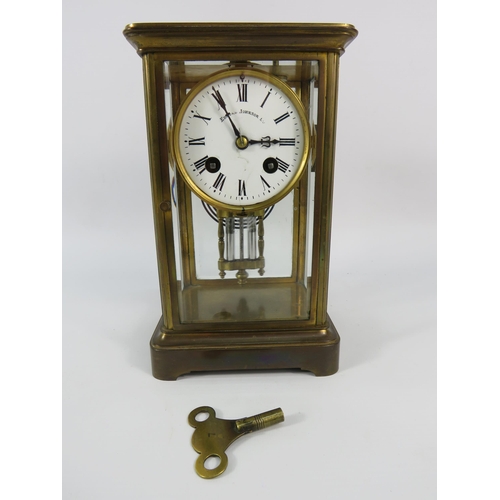 28 - Edmund Johnson enamel face French brass skeleton mantle clock with Mercury Pendulum, 8 3/4