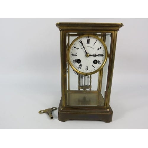 28 - Edmund Johnson enamel face French brass skeleton mantle clock with Mercury Pendulum, 8 3/4