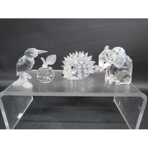 38 - Four Swarovski figurines Kingfisher, Apple, Large Hedghog and Elephant.