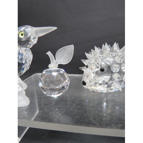 38 - Four Swarovski figurines Kingfisher, Apple, Large Hedghog and Elephant.