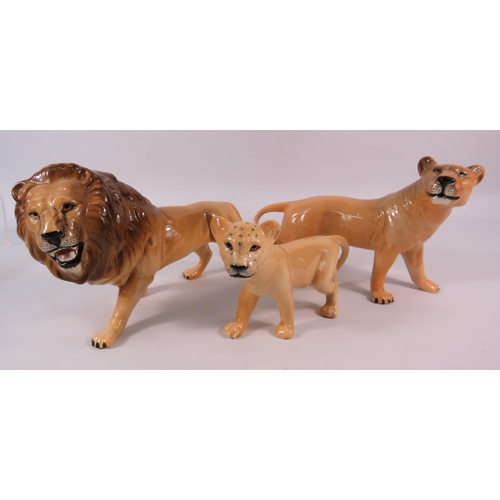 55 - Beswick Lion family figurines.