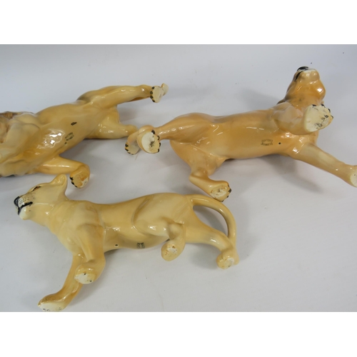 55 - Beswick Lion family figurines.