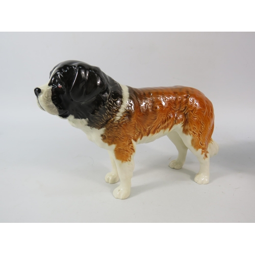 64 - Three Beswick Dog figurines, St Bernard, Cavalier King Charles and Bassett Hound, the tallest stands... 