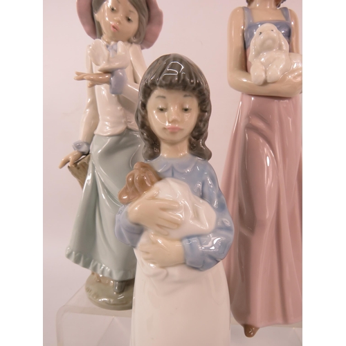 76 - Three Nao figurines of Girls with animals, the tallest measures 9.5