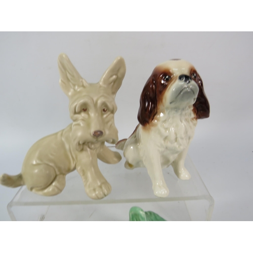 79 - Three Sylvac dog figurines and a Lomonosov lion cub, the tallest measures 5