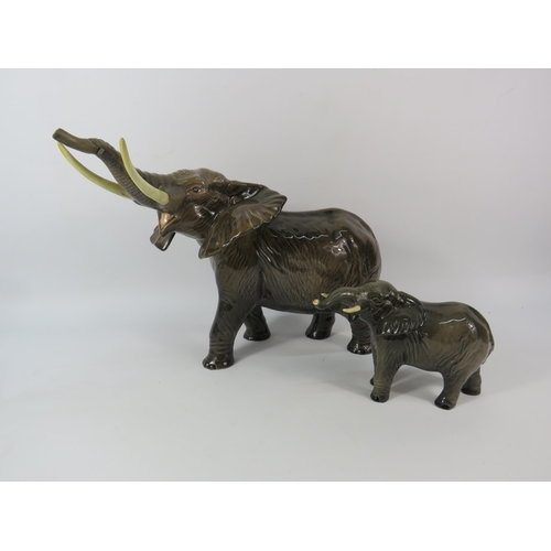 87 - One large and one small Beswick Elephants, the larger stands 10