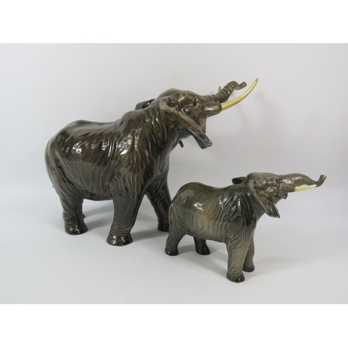 87 - One large and one small Beswick Elephants, the larger stands 10