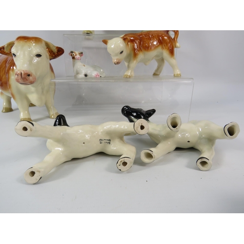 95 - Coopercraft Hereford Cow family plus other cow and sheep figurines.