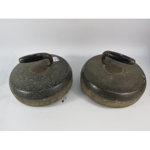 97 - Pair of Antique Granite curling stones with ebonised handles.