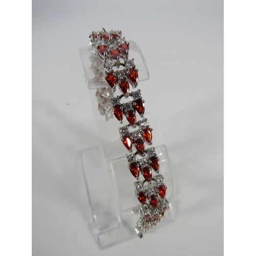 121 - 925 Sliver lab created Garnet and white topaz bracelet.