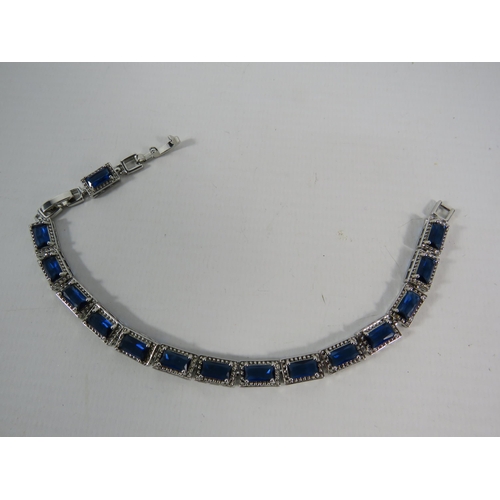 122 - 925 Silver lab created Sapphire bracelet with extention link.