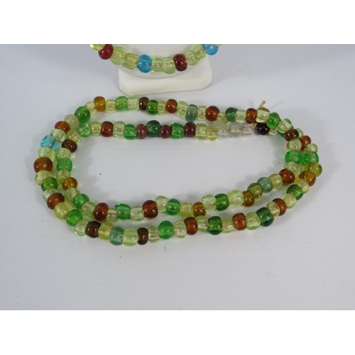 123 - Two vintage uranium glass beaded necklaces.