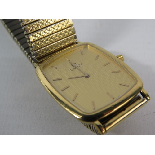 133 - Gents Gold tone Omega DeVille quartz wristwatch with stainless steel expanding strap, will require n... 