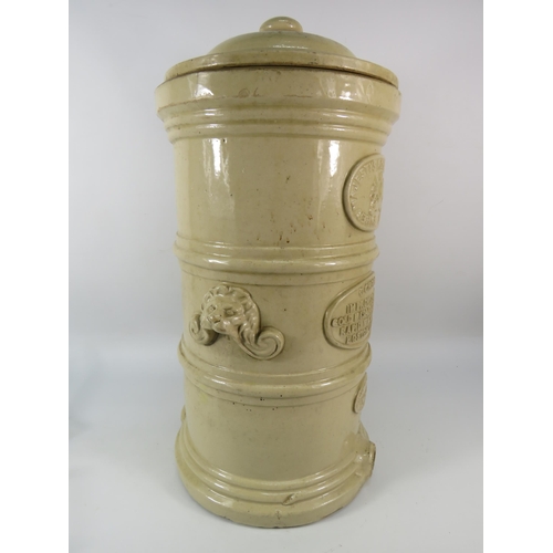 99 - A late Victorian Stoneware water filter with lion head handles by G Cheavins Boston Lincolnshire, 21... 