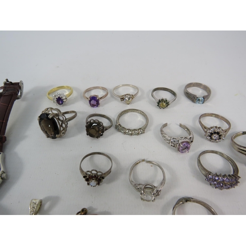 134 - Fourteen 925 silver rings set with various stones, a 9ct back and front locket and three ladies wris... 