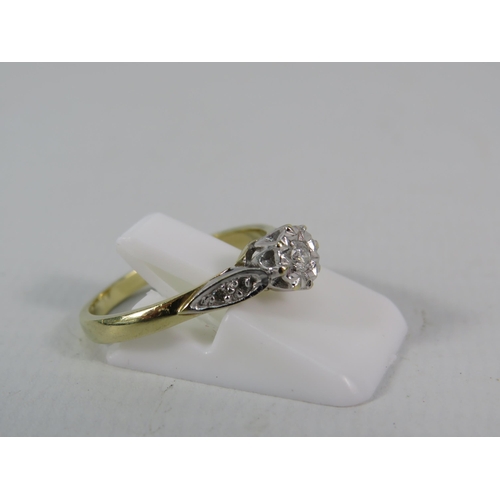 150 - 9ct Gold 10pt Diamond set solitaire ring with two small diamonds set to each shoulder, finger size 