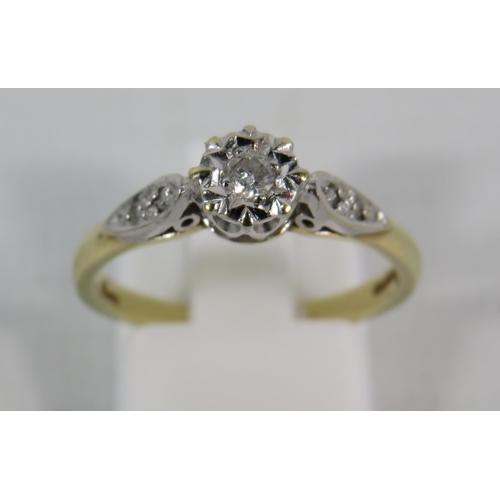 150 - 9ct Gold 10pt Diamond set solitaire ring with two small diamonds set to each shoulder, finger size 