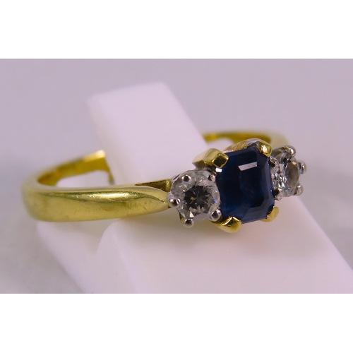 151 - 18ct Gold Ring set with a 4mm by 5mm Sapphire and two 1/16 carat diamonds, finger size 