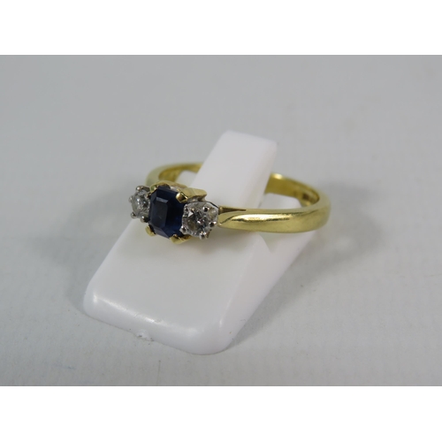 151 - 18ct Gold Ring set with a 4mm by 5mm Sapphire and two 1/16 carat diamonds, finger size 