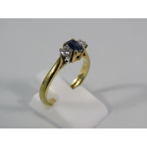 151 - 18ct Gold Ring set with a 4mm by 5mm Sapphire and two 1/16 carat diamonds, finger size 