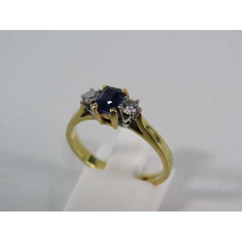 151 - 18ct Gold Ring set with a 4mm by 5mm Sapphire and two 1/16 carat diamonds, finger size 